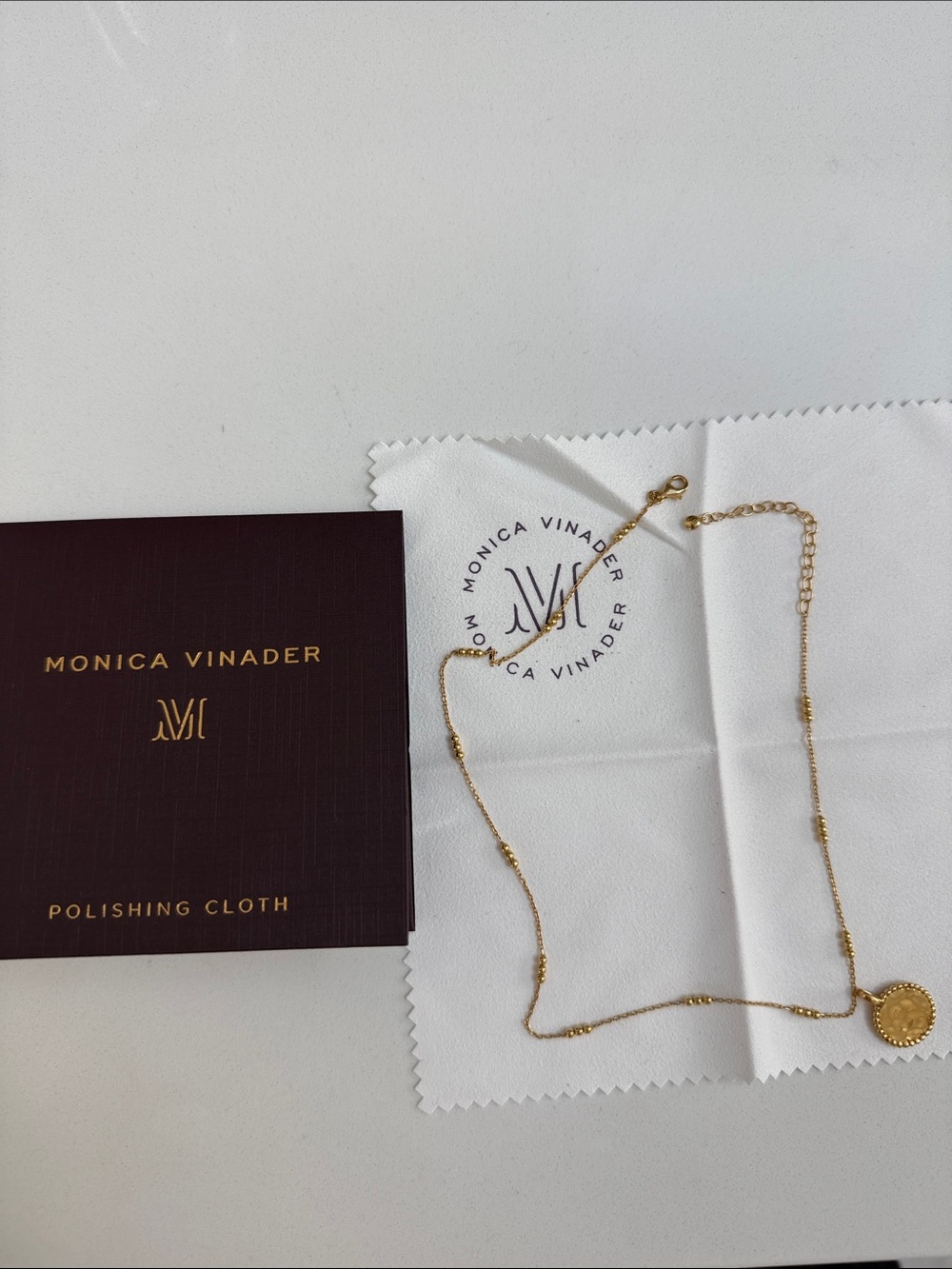 MONICA VINADER gold chain with coin pendant and polishing cloth